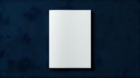 Blank white paper sheet on dark blue textured background for mockup design projects and creative presentations.