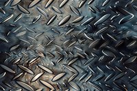 Diamond plate metal surface with industrial tread pattern showing detailed texture and reflective highlights in blue-tinted steel finish.