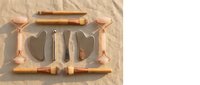 Rose gold facial massage tools set with gua sha stones and rollers for skincare routine and spa treatments on neutral linen background.