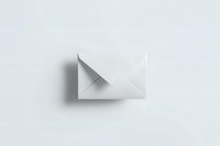 Minimalist white paper airplane on light background with soft shadow, representing simplicity and communication concepts. Clean composition for business designs.