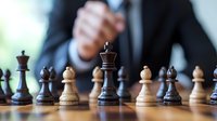 Business professional in suit making strategic move on wooden chess board, with focus on dark king piece against blurred opponent, representing leadership and decision making.