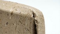 Close-up of natural cork material showing organic texture and porous surface structure for sustainable packaging and eco-friendly product design applications.