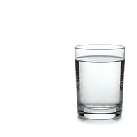 Clear glass filled with fresh water and bubbles isolated on white background for healthy lifestyle and hydration concepts.