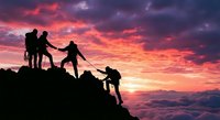 Team of hikers helping each other climb mountain peak at dramatic sunset with vibrant pink and purple sky. Teamwork and leadership concept for business success.