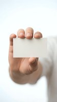 Hand holding blank white business card mockup template for branding and corporate identity design projects on clean background.