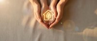 Hands cupping a glowing eco house icon with a leaf, symbolizing green energy, sustainable living, and environmental care.