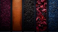 Vibrant vertical panels showcase diverse textures and colors - burgundy crystals, copper metallic, black stone, crimson petals, and deep blue fragments create dramatic contrast.