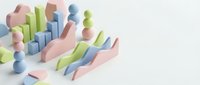 Colorful 3D geometric shapes and abstract forms scattered on white background for modern design projects and creative presentations.