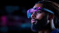 Young African American man wearing futuristic augmented reality glasses with purple and blue reflections against dark background with neon lighting effects.