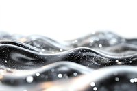 Abstract flowing waves with glowing particles and bokeh effects on dark background create dynamic motion and ethereal atmosphere in monochromatic style.