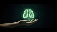 Caucasian male hand holding glowing green lungs against dark background, representing respiratory health, medical care, and pulmonary wellness for healthcare design.
