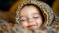 Peaceful sleeping child wrapped in cozy knitted blanket showing gentle smile and serene expression, soft focus portrait in warm natural lighting.