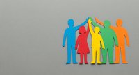 Colorful paper cutout figures holding hands in unity representing teamwork, diversity, inclusion and community support on neutral background.