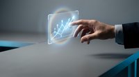 Businessman hand touching holographic upward trending chart with glowing neon lines on gray background for financial growth, data analysis, and business success concepts.