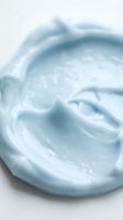 Creamy light blue whipped texture with soft swirls, ideal for skincare, cosmetics, moisturizer, lotion, and beauty product packaging design backgrounds.