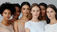 Diverse group of young women with different skin tones and ethnicities showing natural beauty and minimal makeup against neutral background for beauty and fashion.