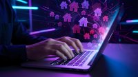 Digital real estate technology concept with hands typing on laptop and glowing house icons floating above screen in futuristic neon lighting for proptech applications.