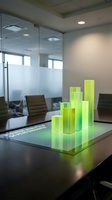 Glowing green holographic bar chart on a conference room table, representing business analytics and financial growth performance data.