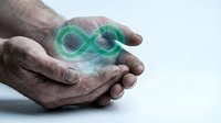 Elderly hands protecting glowing green infinity symbol representing eternal care, sustainability and endless possibilities for future generations.