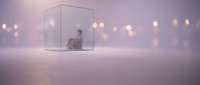 Young woman sitting alone inside transparent glass cube in dreamy purple atmosphere with warm bokeh lights creating surreal conceptual scene.