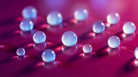 Translucent glass spheres with glowing light reflections scattered across a vibrant magenta and pink gradient background, creating an abstract and modern aesthetic for design projects.