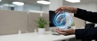 Professional businessman hands protecting glowing digital compass hologram in modern office workspace representing guidance and strategic direction.