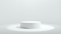 White cylindrical podium on a clean light background with soft spotlight, perfect for product display and presentation mockups.
