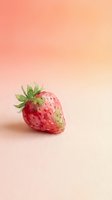 Fresh ripe strawberry with green leaves on soft pink gradient background for healthy eating and summer fruit concepts.