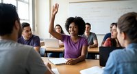 Young African American female student raising hand in college classroom with diverse classmates during interactive learning session.