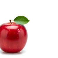 Fresh red apple with green leaf and water droplet isolated on white background for healthy eating and nutrition concepts.