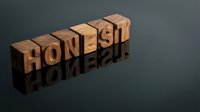 Wooden letter blocks spelling HONEST with mirror reflection on dark surface representing integrity, trust, and ethical business values in corporate communication.