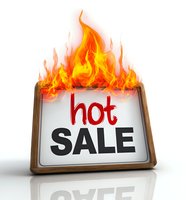 Burning hot sale sign with flames on wooden frame, isolated on white background for promotional marketing and special offers.