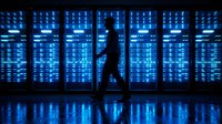 Silhouette of person walking through futuristic data center with glowing blue server racks and digital code streams for technology concepts.
