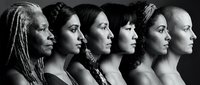 Diverse group of women in profile showing different ethnicities and ages representing unity, sisterhood and female empowerment in black and white portrait.
