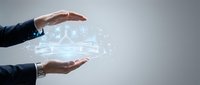 Business professional hands protecting digital car technology with glowing network connections and data visualization for automotive innovation concepts.