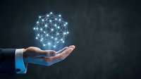 Business hand holding glowing network sphere with connected nodes representing digital transformation, connectivity and modern technology solutions.