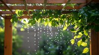 Sunlit wooden pergola with hanging string lights and lush green leaves creating magical garden atmosphere, bokeh effect in background, summer outdoor decoration.
