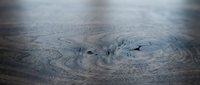 Aerial view of a massive hurricane or tropical cyclone with swirling cloud formations and a defined eye structure, suitable for weather, climate, and disaster-related content.