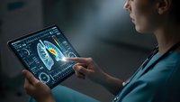 Female healthcare professional analyzing brain scan data on digital tablet with futuristic medical interface technology for neurological diagnosis.