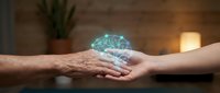 Young woman and mature man holding glowing brain hologram together, representing knowledge transfer, mentorship, and collaborative learning in modern technology environment.