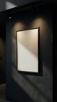 Empty white canvas in wooden frame hanging on dark wall with dramatic lighting and shadows creating modern gallery atmosphere for art display.