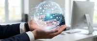 Businessman hand holding holographic globe with network connections in modern office environment showcasing global digital technology and connectivity solutions.