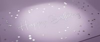 Elegant purple birthday card with silver Happy Birthday script and scattered star confetti, soft glowing light, festive celebration stationery.