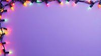 Colorful Christmas lights border frame on purple background with copy space for holiday message or festive design element.