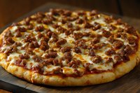 Fresh baked pizza topped with melted mozzarella cheese and seasoned ground beef on golden crispy crust, served on rustic wooden surface. For menu and food advertising.