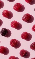 Fresh ripe raspberries arranged in diagonal pattern on pink background with harsh shadows creating modern minimalist food composition for healthy eating concept.