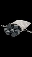 Polyhedral dice set in dark gray stone with linen drawstring pouch, isolated on transparent background. Ready for t-shirt design, clipart, stickers, print-on-demand, and sublimation projects.