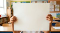 Young child with medium skin tone holding blank white poster board in classroom setting, ideal for educational messaging and promotional campaigns.