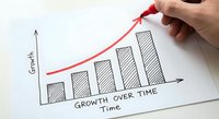 Hand drawing red growth arrow on business chart showing increasing bar graph with growth over time axis for financial success and progress analysis.