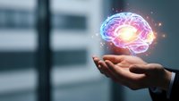 Businessman hand holding glowing digital brain with neural network connections in modern office environment for artificial intelligence concepts.